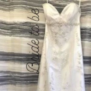 Beautiful white lace embellished bridal gown